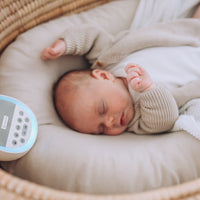 baby sleeping with dream pod white noise machine