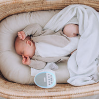 Baby sleeping with Dream Pod white noise machine