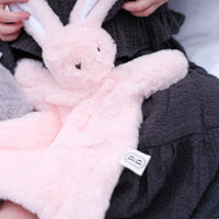Dreamy days pink bunny comforter on Childs lap