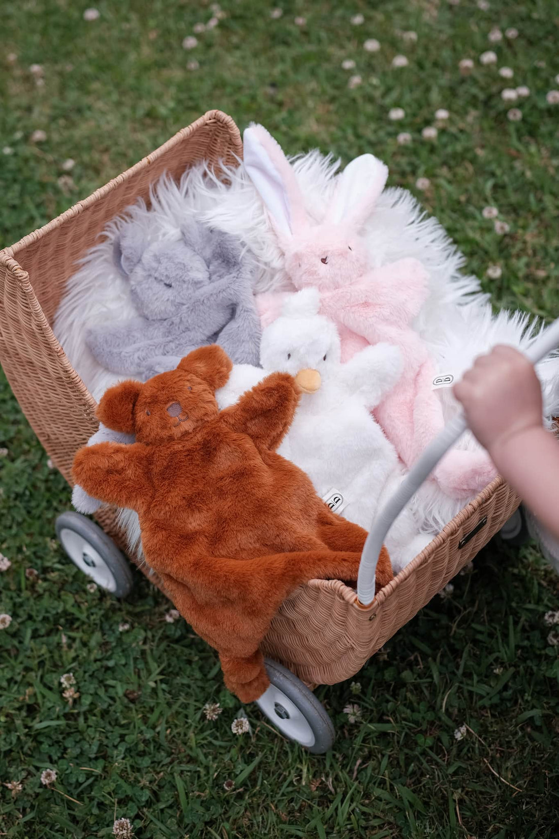 Dreamy days brown bear pink bunny white goose grey mouse comforter in pram on grass
