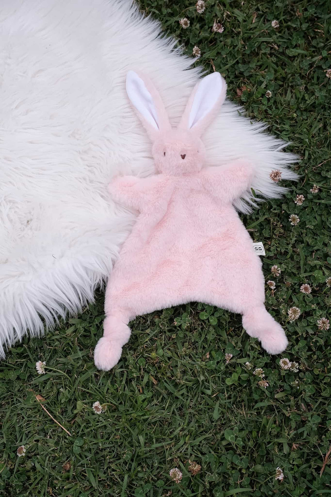 Dreamy days pink bunny comforter on grass