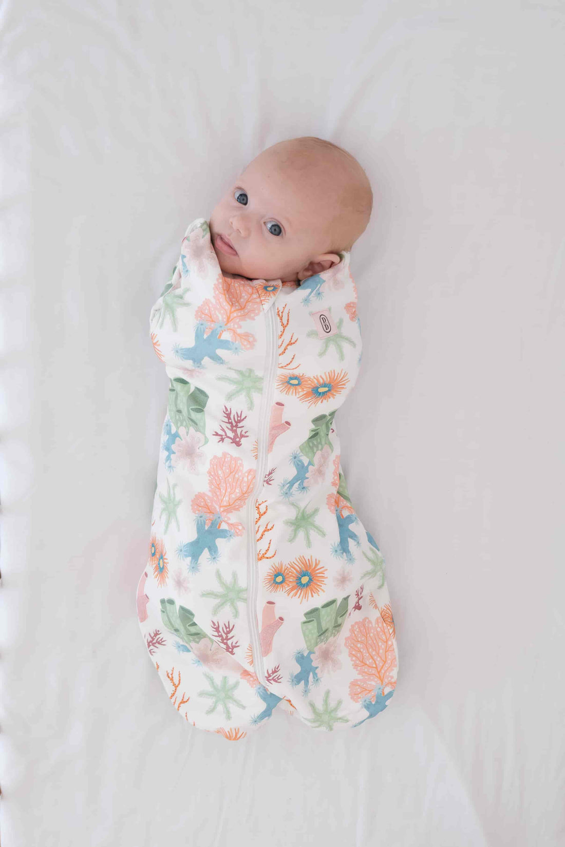Dreamy days baby dream swaddle pink coral of white surface