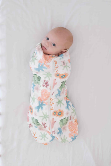 Dreamy days baby dream swaddle pink coral of white surface