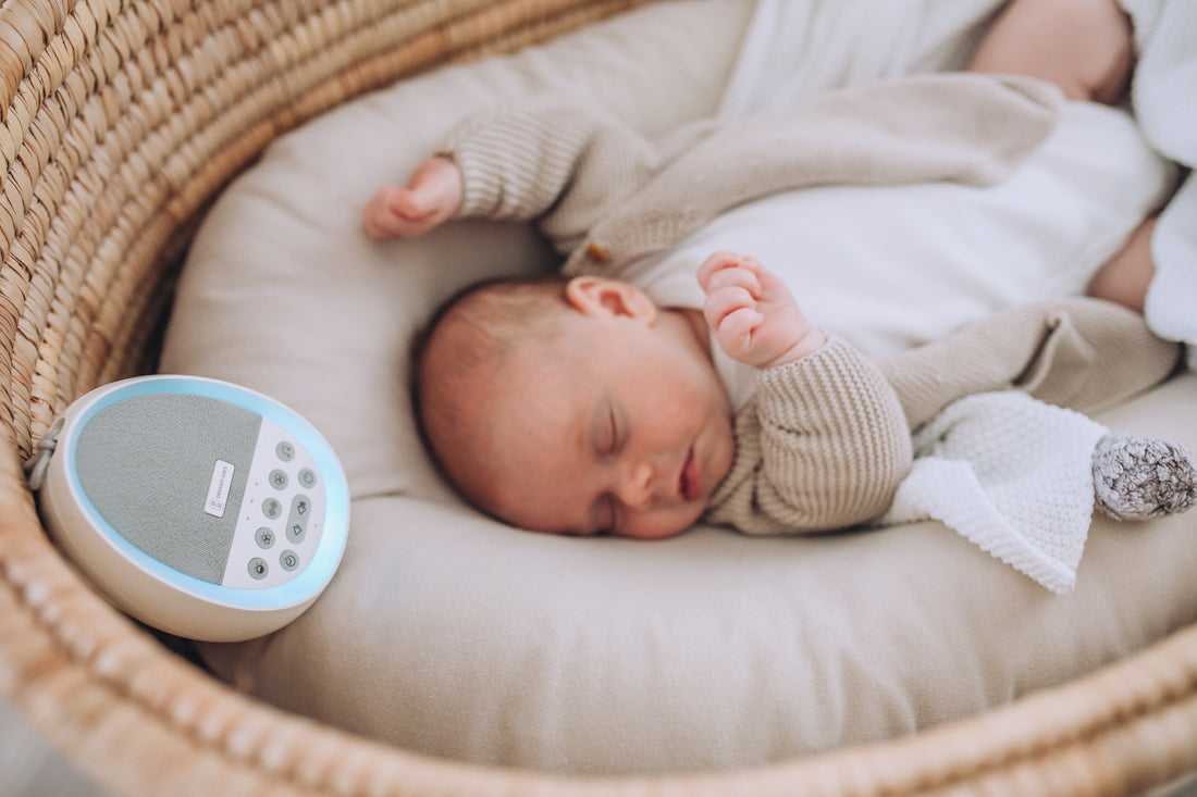 baby sleeping with dream pod white noise machine