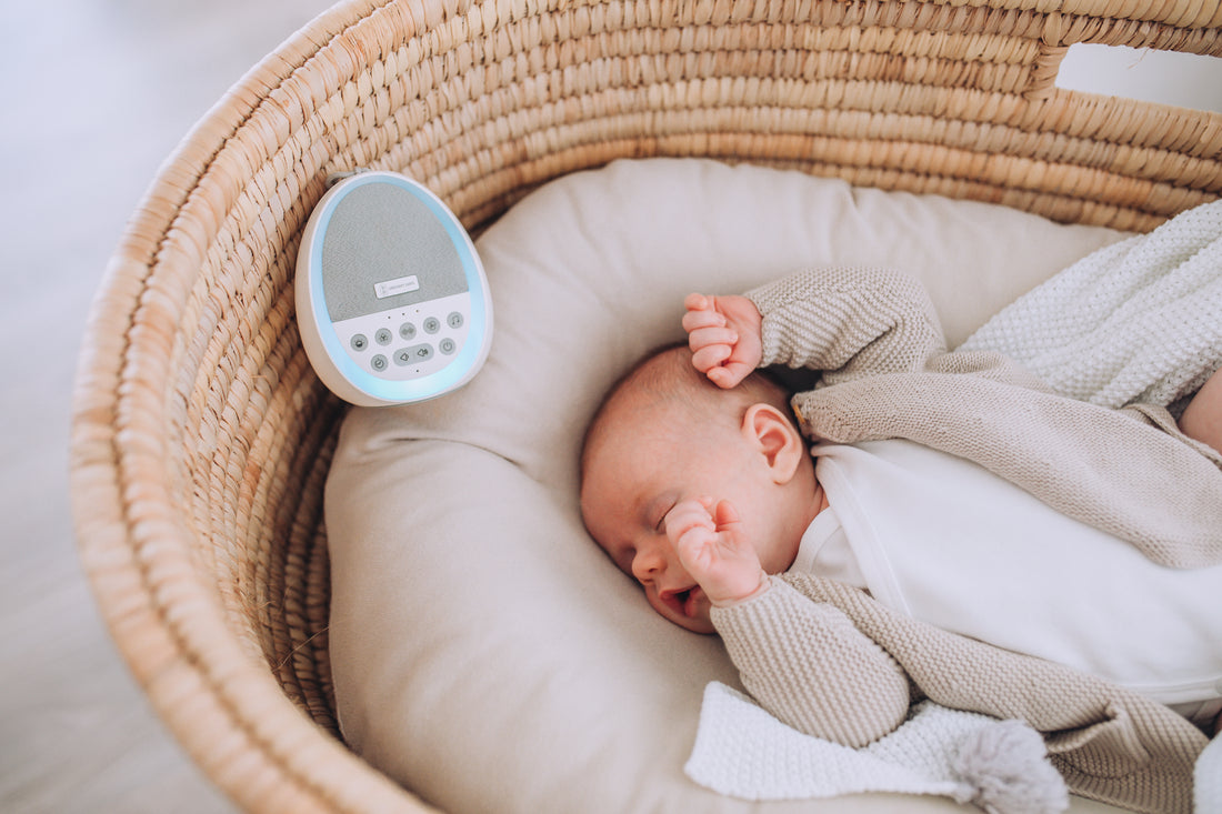 Baby sleeping with Dream Pod white noise machine