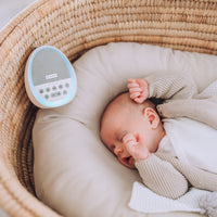 Baby sleeping with Dream Pod white noise machine