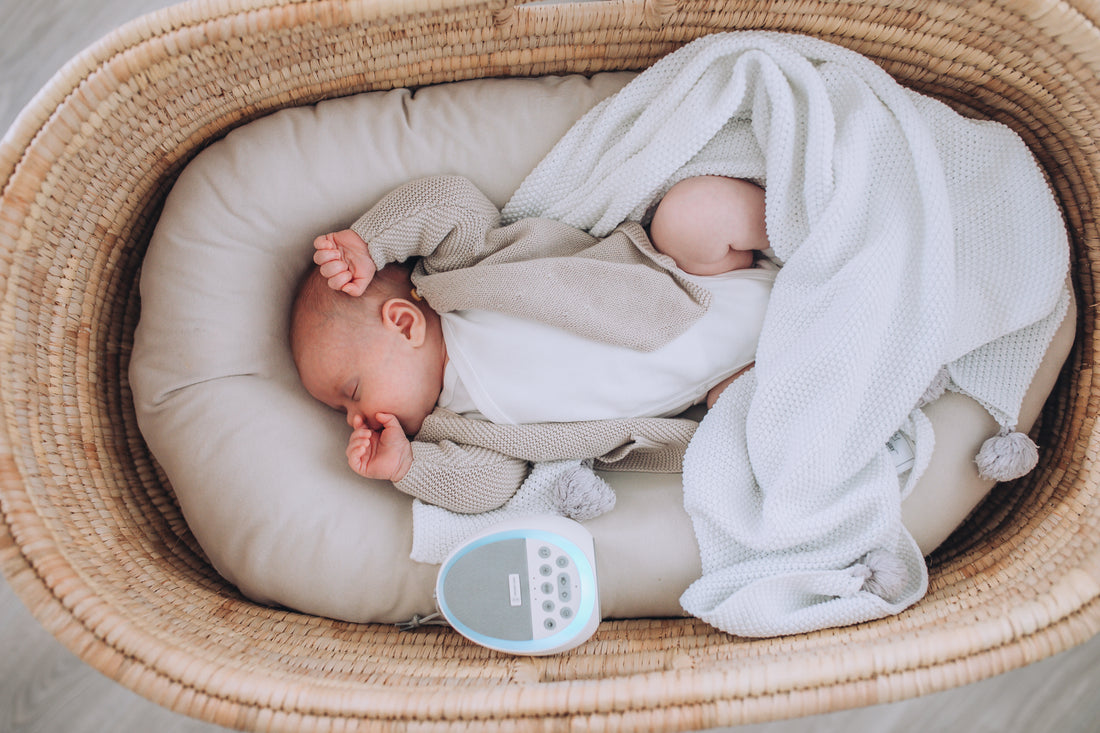 Baby sleeping with Dream Pod white noise machine